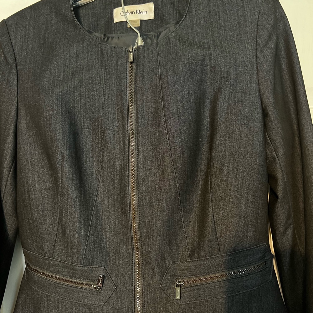 Calvin Klein modern fit suit. Gun metal accent zippers. Dark blue denim look.